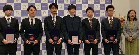 Group photo at the Best Poster Award Ceremony (Science Campus Hall) Prof. Motoko Kotani, Director and Symposium Chair (right) with the award winners who participated in the Award ceremony